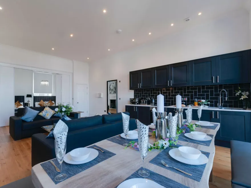 80 Rodney Street - Dining Table with Living Area and Bedrooms