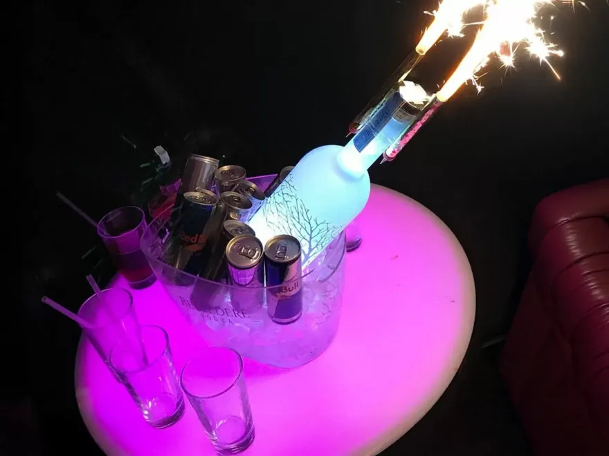 Nightclub Entry with Table & Drinks