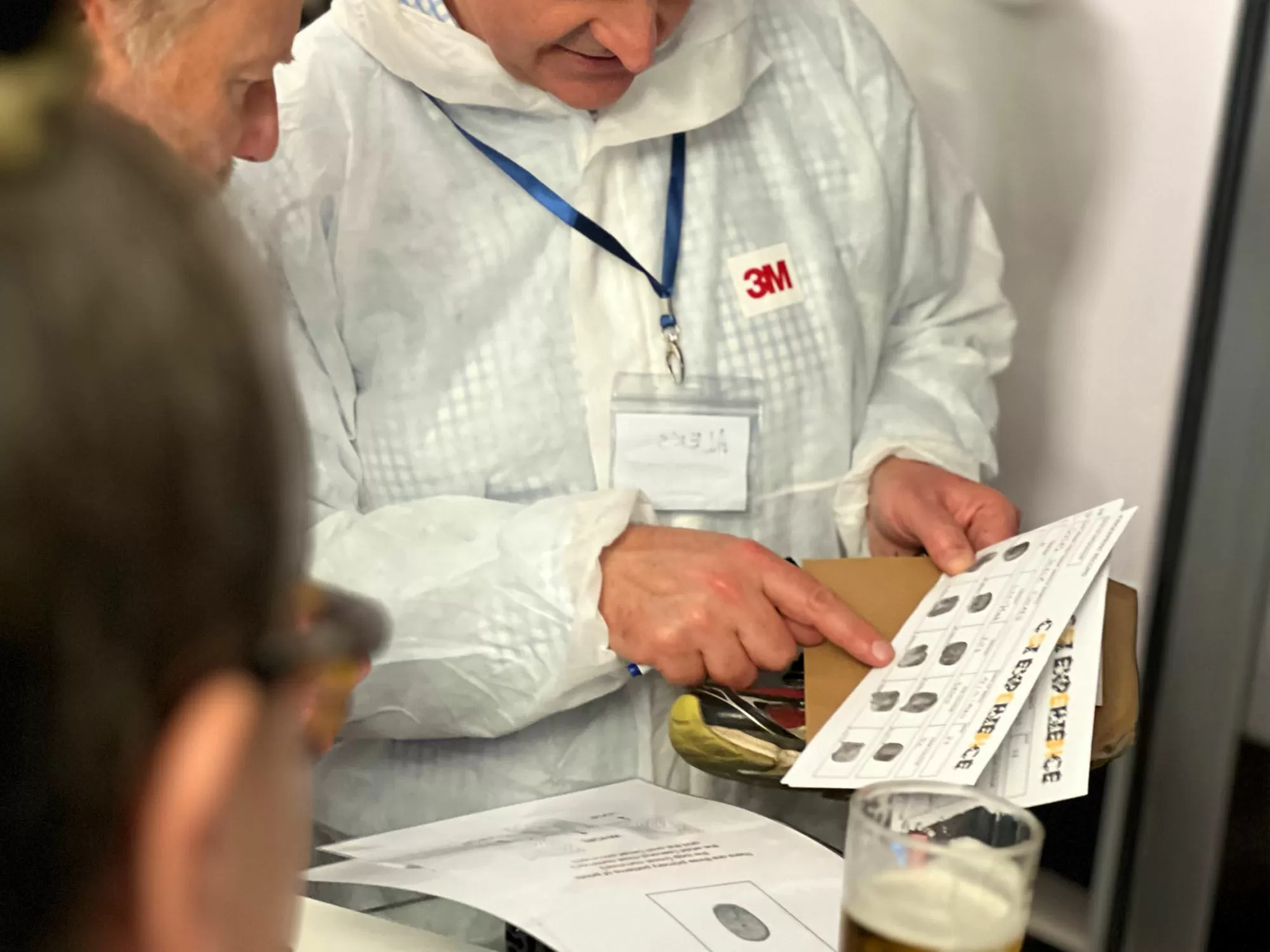 Team taking part in an indoor team building activity in a Liverpool venue, such as cocktail making or chocolate workshop
