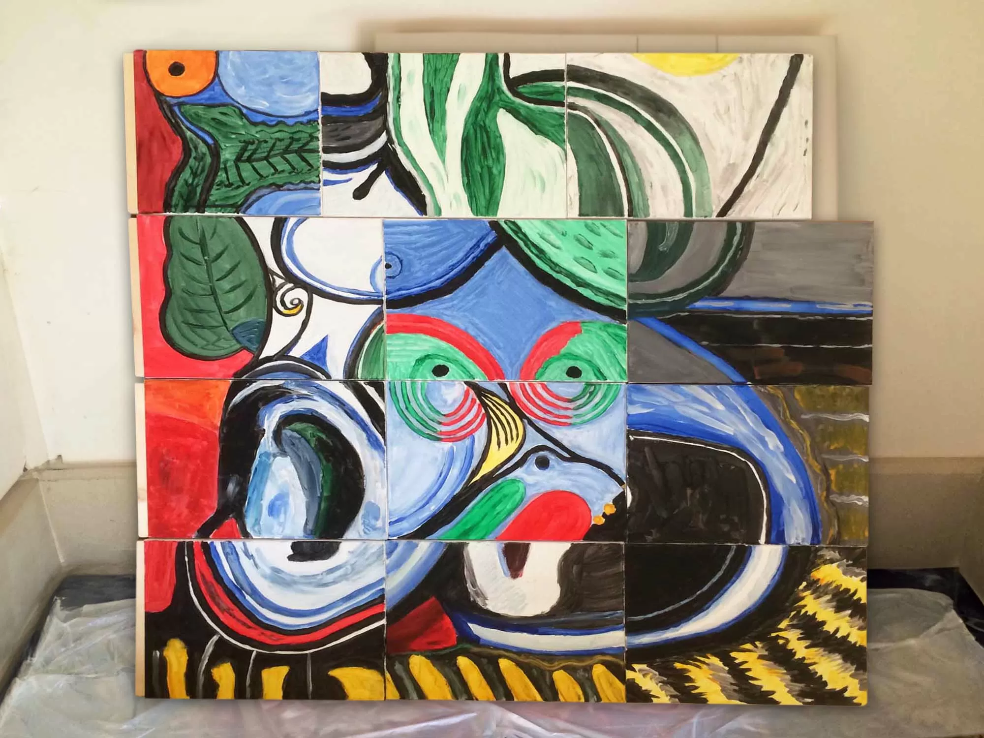 Teams working on collaborative canvas painting challenge in Manchester