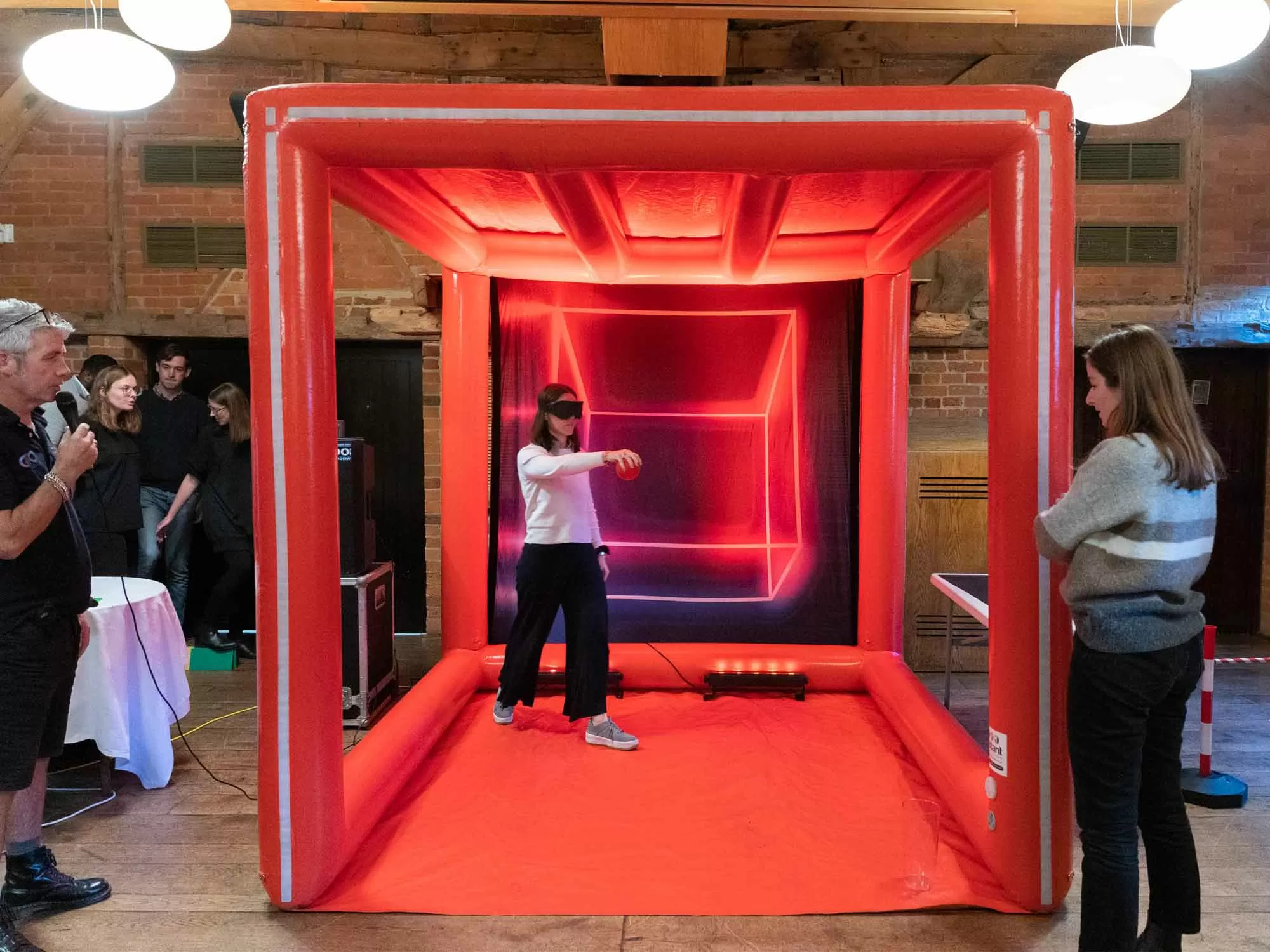 Team playing Qubed indoor cube challenge in a Manchester venue