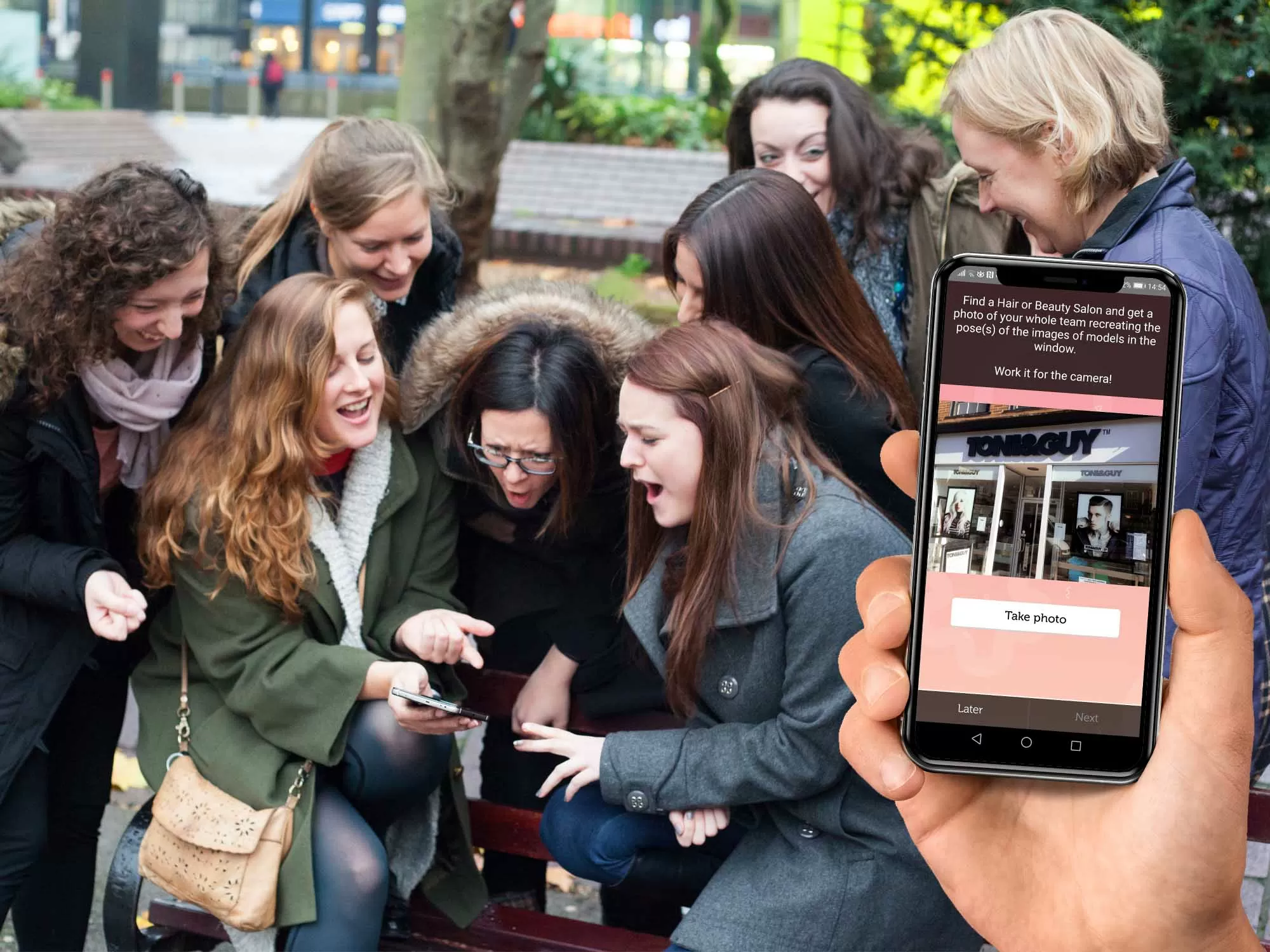 Team exploring Deansgate during a smartphone treasure hunt in Manchester